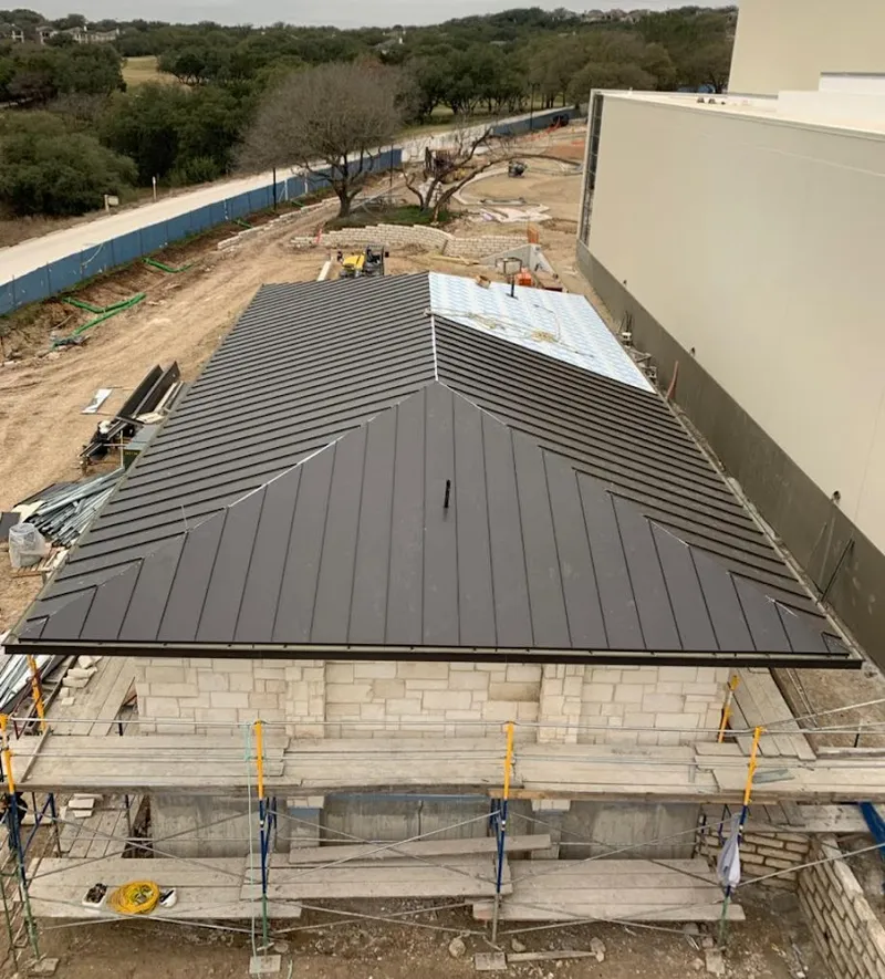 Metal roof new construction with scaffolding in Brookfield